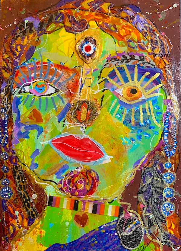 original multimedia abstract artwork of woman's face, w multicolored eyes, red lips, large gold eyelashes, and gold / brown hair / headdress, plus a jewel on her forehead at the third-eye, created by Lisa Johnson Arts in Norwich VT