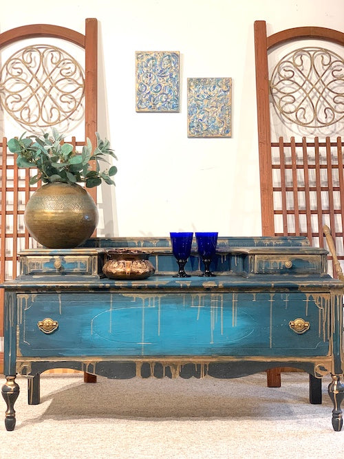 Blue hand-painted antique sideboard, buffet, or blanket chest with copper dripping down, created by Lisa Johnson Arts Norwich VT, with blue and copper paintings above and wooden trellises behind