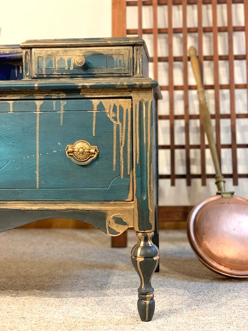 Blue hand-painted antique blanket chest with copper dripping down, created by Lisa Johnson Arts Norwich VT, with copper bedwarmer beside