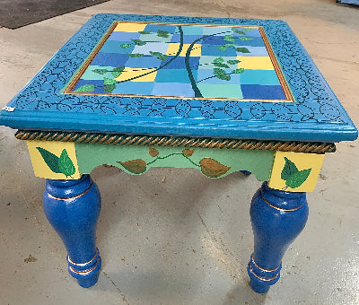 Moroccan Style Side Table with copper blue greens leaves showing one view from side angle by Lisa Johnson Arts in Norwich Vermont