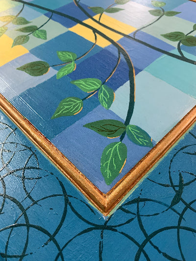 Moroccan Style Side Table with copper blue greens leaves showing one corner from the top angle by Lisa Johnson Arts in Norwich Vermont