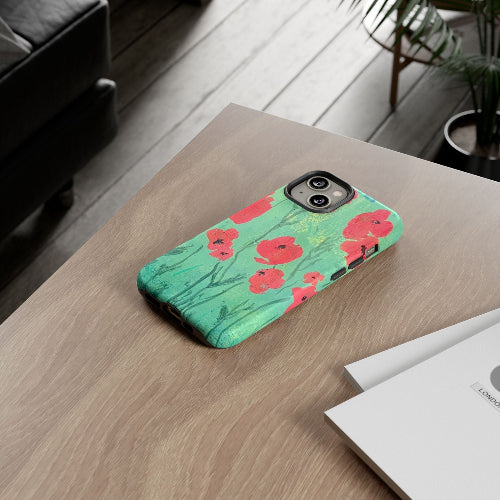 iPhone case w red poppies original artwork sitting on desk, by Lisa Johnson Arts in Norwich Vermont